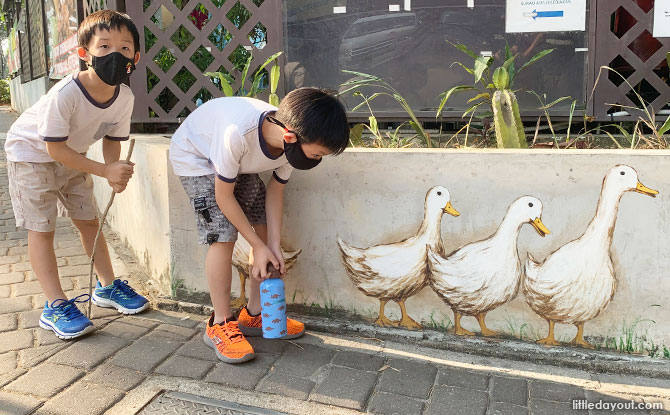 Author's children feeding ducks
