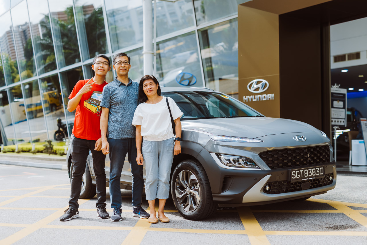 Mr Michael Liu with his son Mr Louis Liu and wife Mrs Catharine Liu at Komoco Motors