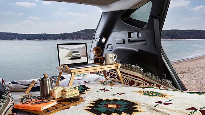Hyundai TUCSON interior with laptop