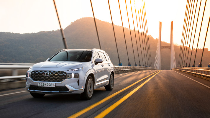 Hyundai Santa Fe driving on bridge