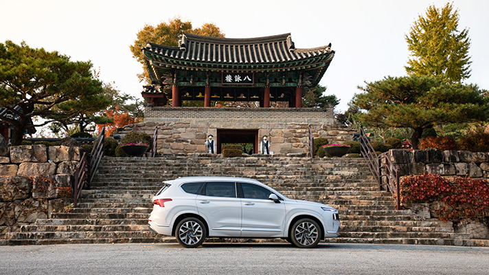 Hyundai Santa Fe parked in front of temple